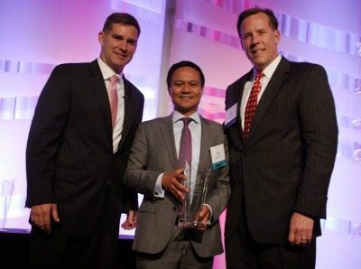 Gala Co-Chairs Cameron Hamilton and Scott Brezler present MicroPact's Kris Collo SECAF's Government Contractor of the Year ($12-25 Million) Award. Photo courtesy of SECAF. 