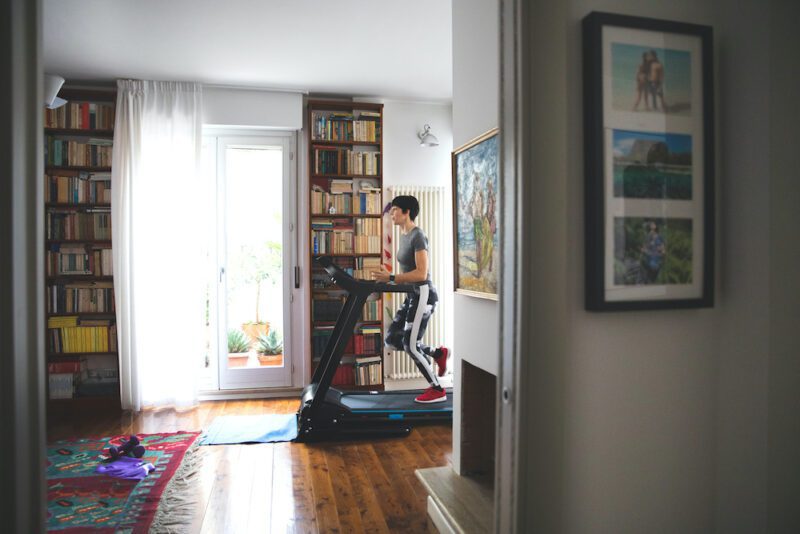 Woman getting fit and doing home training in the living room