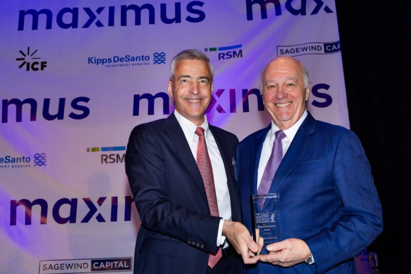 Maximus CEO Bruce Caswell with Richard Montoni.